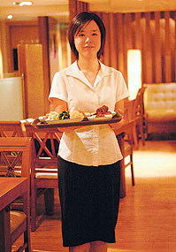'Suji, our lovely waitress, whose favourite dish on the menu is a mighty bowl of ojing uh kan poong gi'