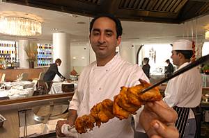 A Moti Mahal chef gets the rods ready for the tandoor