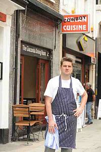 Cowboy Paul Merrony standing outside his restaurant, the Giaconda Dining Room